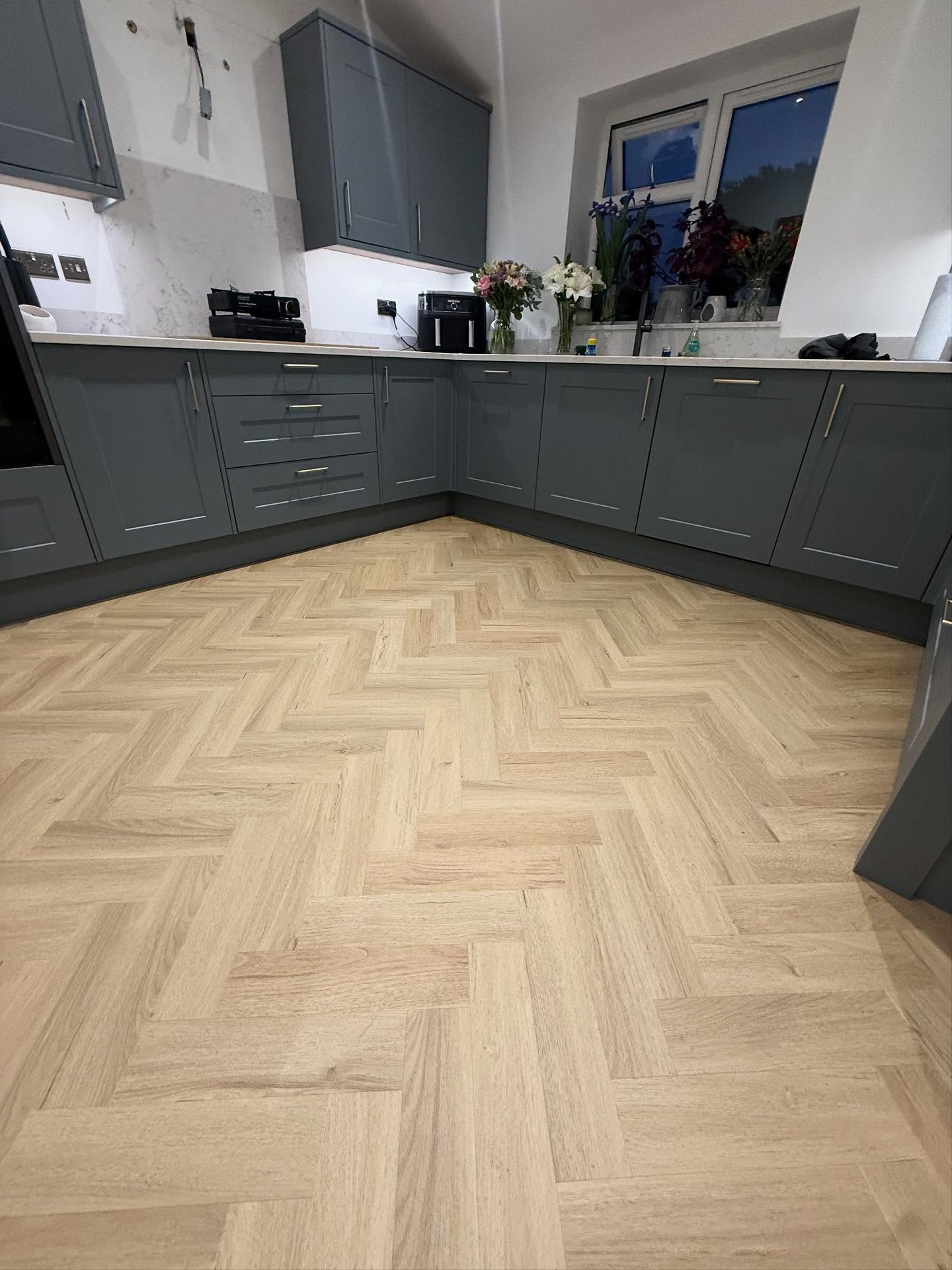 Herringbone wood flooring in elegant living room