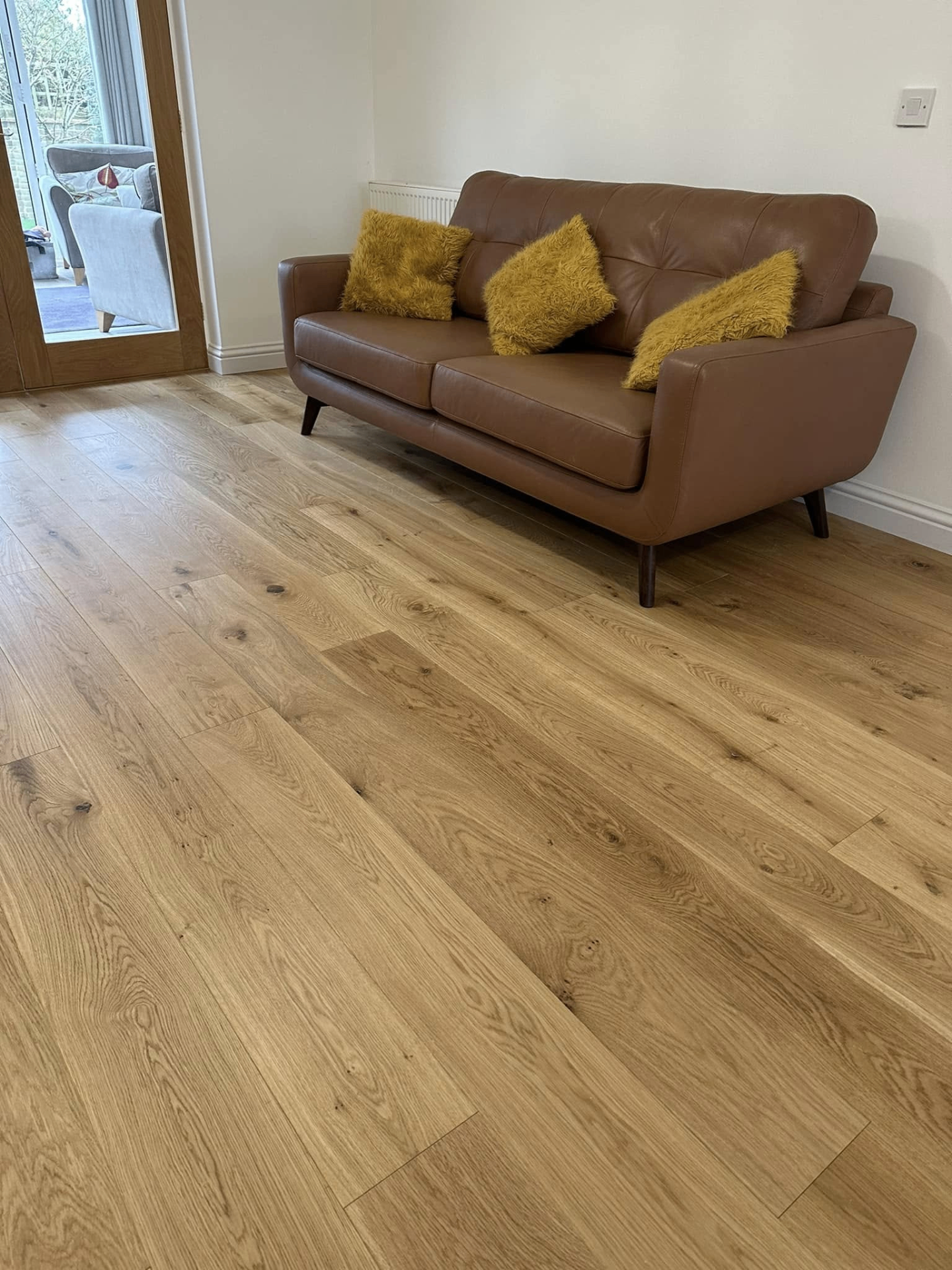 Engineered oak flooring with leather sofa