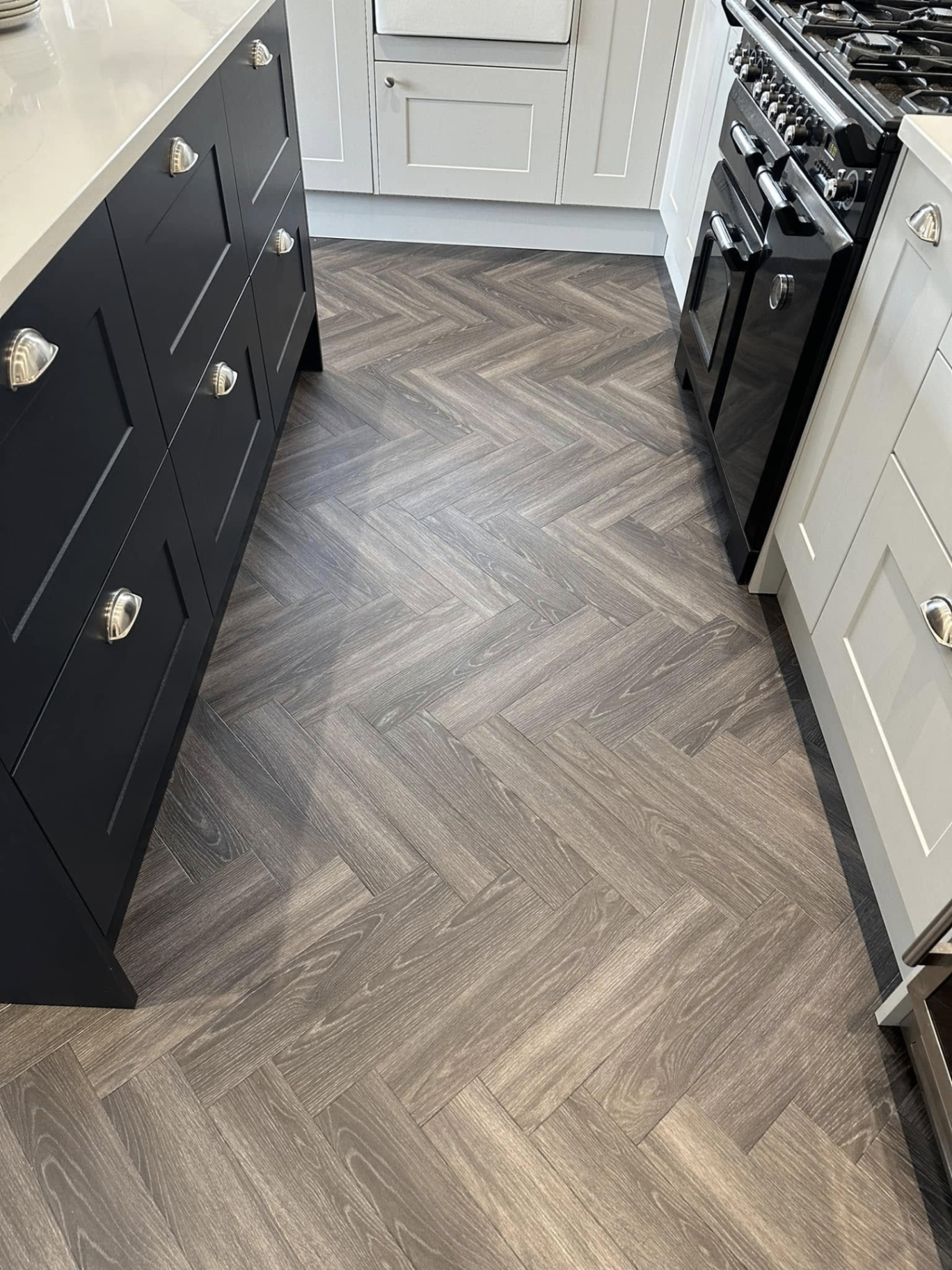 Grey herringbone LVT in shaker kitchen